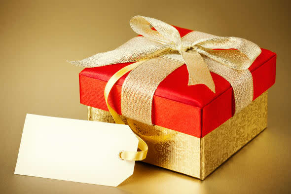 Christmas gift box on gold background