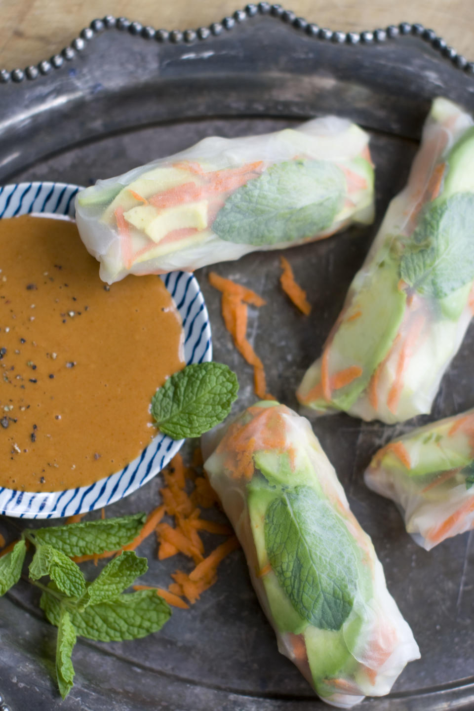 This Dec. 2, 2013 photo shows chicken and jicama spring rolls with peanut sauce in Concord, N.H. (AP Photo/Matthew Mead)