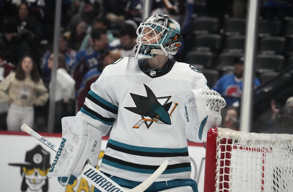 San Jose Sharks goaltender Kaapo Kahkonen reacts aftert giving up a goal to the Colorado Avalanche in the first period of an NHL hockey game Tuesday, March 7, 2023, in Denver. (AP Photo/David Zalubowski)
