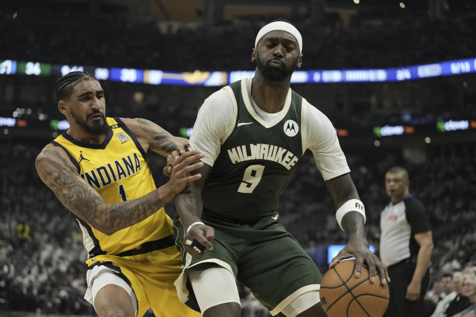 Milwaukee Bucks' Bobby Portis tries to get past Indiana Pacers' Obi Toppin during the first half of Game 2 of the NBA playoff basketball game Tuesday, April 23, 2024, in Milwaukee. (AP Photo/Morry Gash)