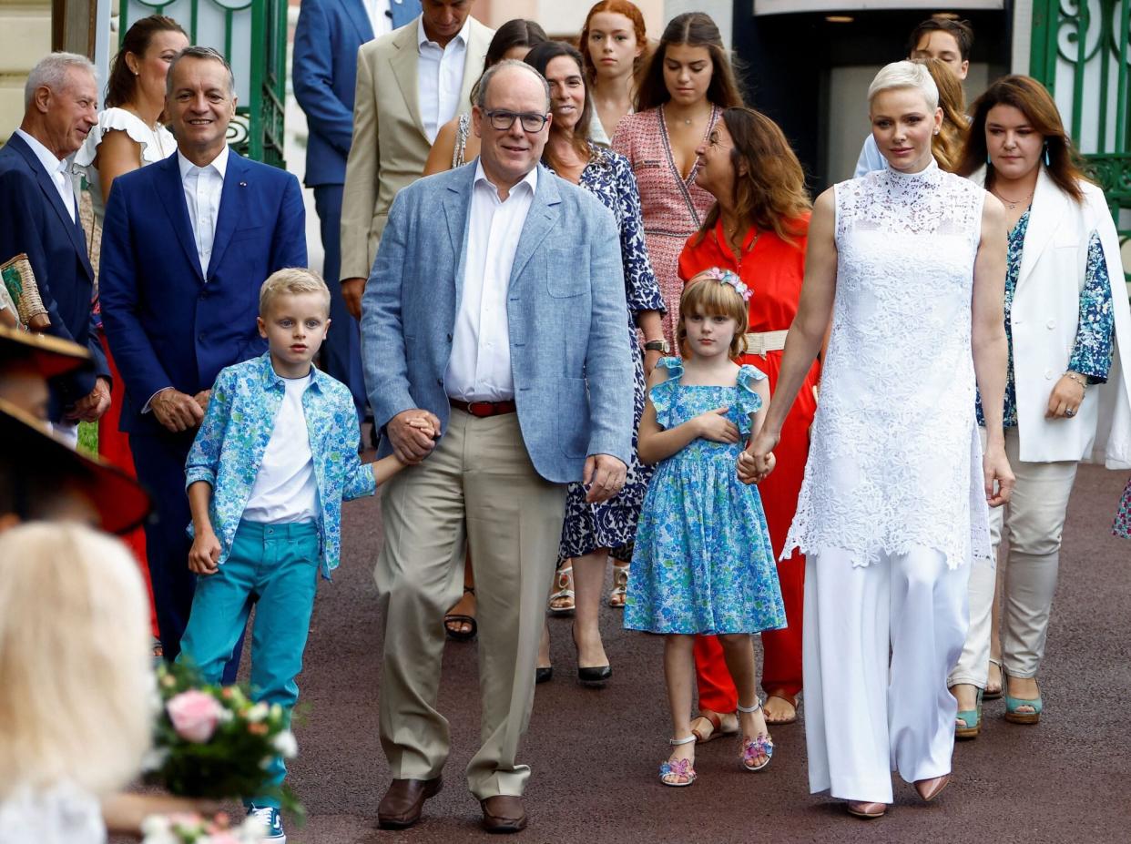 Prince Albert II (2nd L), Princess Charlene (R), Prince Jacques (L), and Princess Gabriella (2nd R) of Monaco arrive to take part in the traditional "U Cavagnetu" Monaco picnic, in Monaco, September 3, 2022. (Photo by ERIC GAILLARD / POOL / AFP) (Photo by ERIC GAILLARD/POOL/AFP via Getty Images)