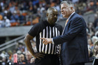 Auburn head coach Bruce Pearl talks to an official during the first half of an NCAA college basketball game against Georgia, Saturday, Jan. 11 2020, in Auburn, Ala. (AP Photo/Julie Bennett)