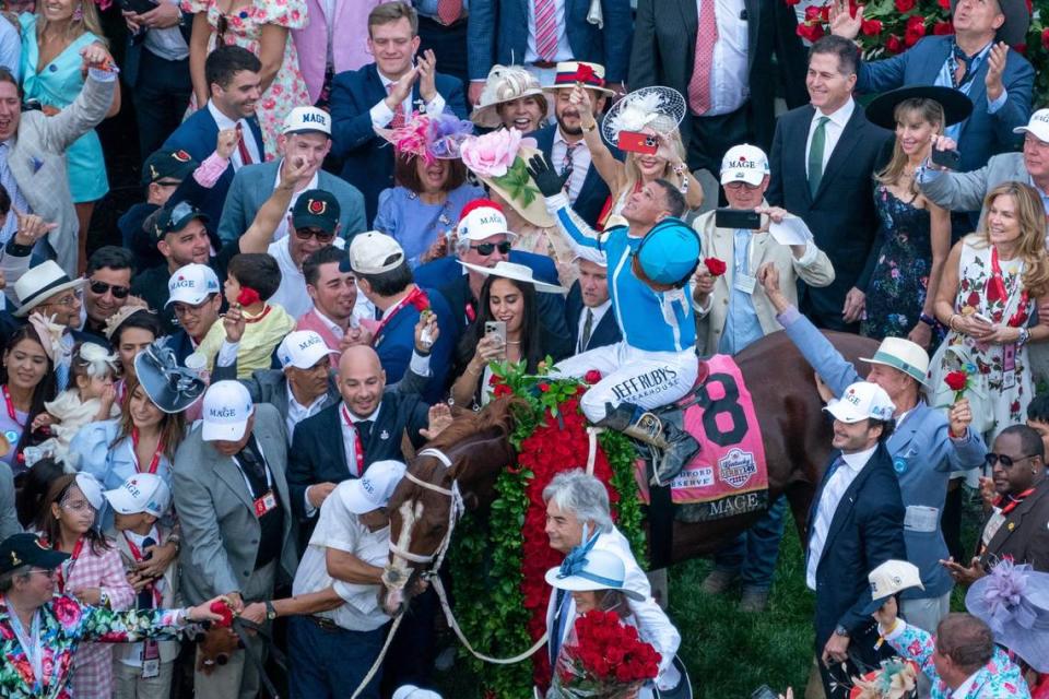 Javier Castellano, aboard Mage, and his connections celebrate their win in the 149th Kentucky Derby at Churchill Downs.