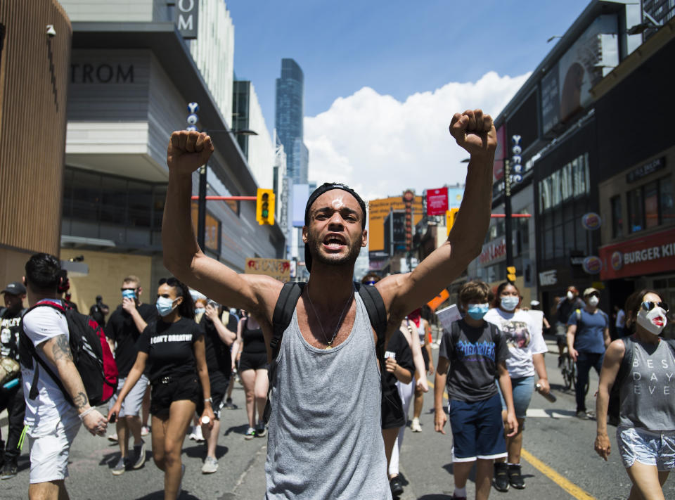Thousands of people protest at an anti-racism demonstration in Toronto on Friday, June 5, 2020. George Floyd, a black man, died after he was restrained by Minneapolis police officers on May 25. His death has ignited protests in the U.S. and worldwide over racial injustice and police brutality. (Nathan Denette/The Canadian Press via AP)