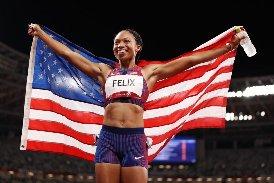 TOKYO, JAPAN - AUGUST 06: Allyson Felix of Team USA reacts after winning the bronze medal in the Women's 400m Final on day fourteen of the Tokyo 2020 Olympic Games at Olympic Stadium on August 06, 2021 in Tokyo, Japan. (Photo by David Ramos/Getty Images)