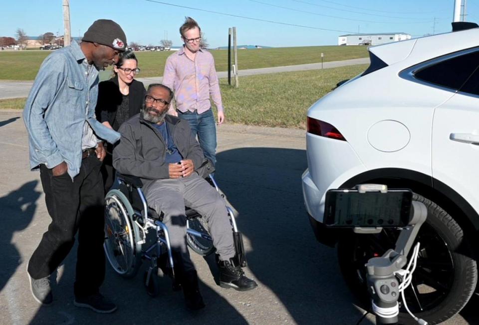 After 43 years in prison for a wrongful incarceration, Kevin Strickland was released from prison on Tuesday, Nov. 23, 2021 in Cameron, Missouri, where attorney Tricia Rojo Bushnell of the Midwest Innocence Project wheeled him to a car as he spoke with fellow exoneree Robert Nelson, left, who was freed after spending nearly 30 years in Missouri prisons.