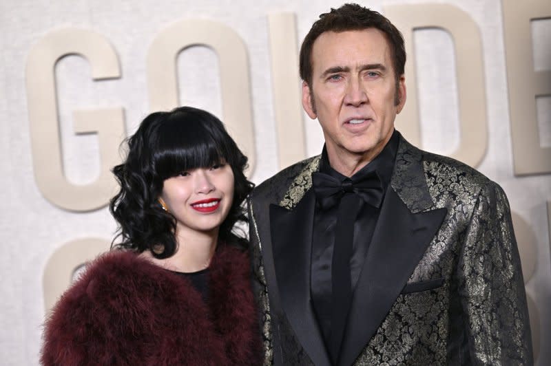 Nicolas Cage (R) and Riko Shibata attend the Golden Globe Awards in January. File Photo by Chris Chew/UPI