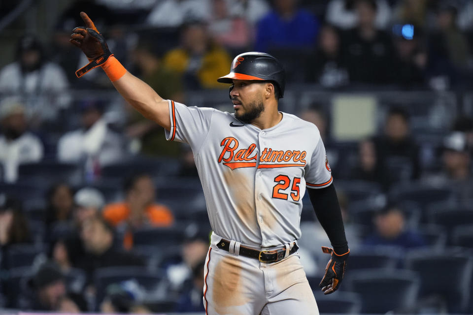 Baltimore Orioles' Anthony Santander (25) gestures to Austin Hays after he scored on a single by Hays during the seventh inning of the team's baseball game against the New York Yankees on Wednesday, May 24, 2023, in New York. (AP Photo/Frank Franklin II)