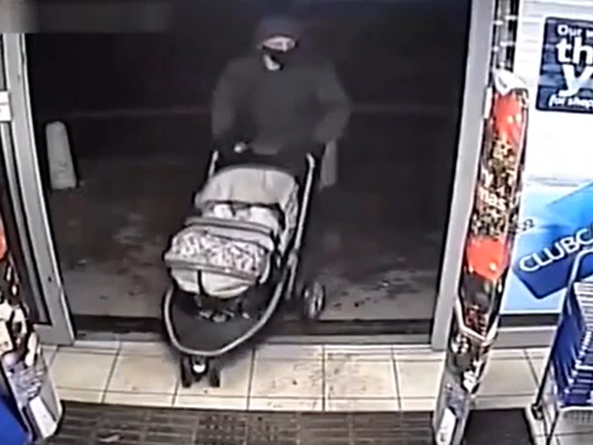 Finley and his father in a Tesco hours before the boy’s death (Derbyshire Police)