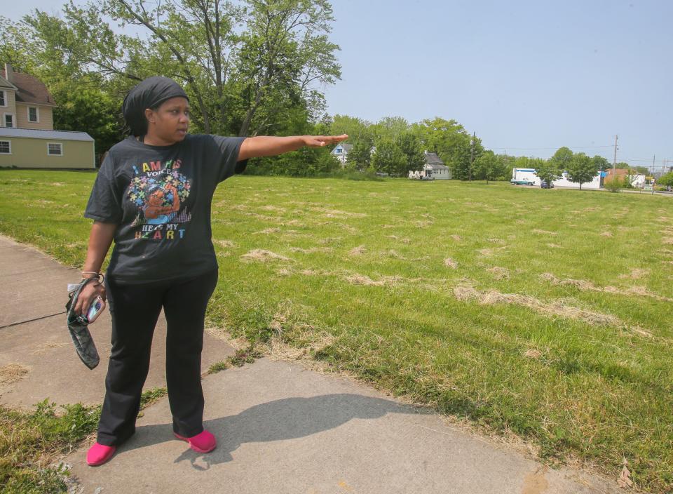 Tamara Coteat talks about breathing in tear gas at an April 19 protest on Copley Road as she stands at the intersection of Copley Road and East Avenue. Coteat has asthma and said the tear gas made her choke and vomit.
