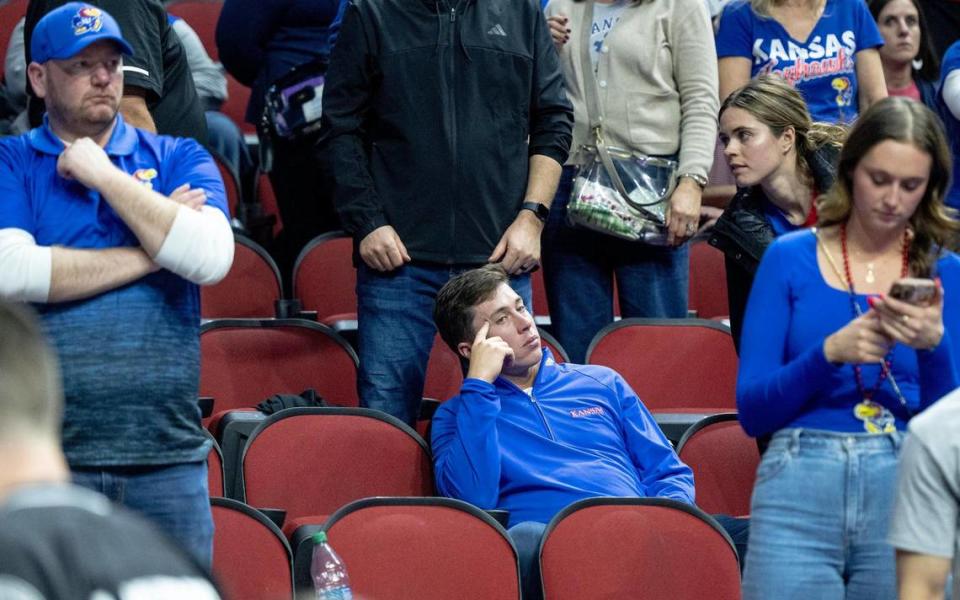 Kansas fans react after the Jayhawks fell 72-71 to Arkansas in a second-round college basketball game in the NCAA Tournament Saturday, March 18, 2023, in Des Moines, Iowa.