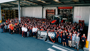 Employees and leadership celebrate the production of the one-millionth tractor, an MF 8S.305 Dyna-VT.