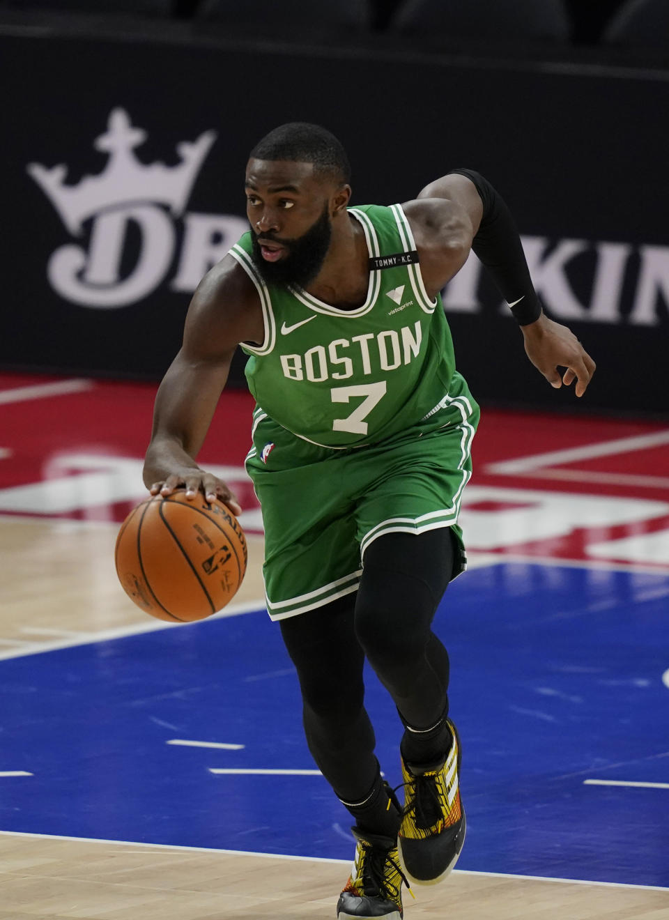 Boston Celtics guard Jaylen Brown brings the ball up during the first half of the team's NBA basketball game agains the Detroit Pistons, Friday, Jan. 1, 2021, in Detroit. (AP Photo/Carlos Osorio)