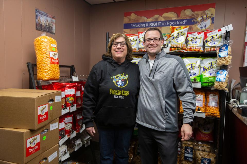 Roma Hailman, owner of Mrs. Fisher's Potato Chips, poses for a photo with company Vice President Chris Spiess on Tuesday, Dec. 13, 2022, at Mrs. Fisher's Potato Chips in Rockford.