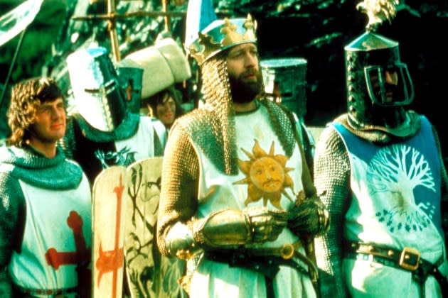 MONTY PYTHON AND THE HOLY GRAIL, Michael Palin (left), Graham Chapman as King Arthur (crown), Terry - Credit: Courtesy Everett Collection