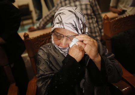 Sanwar Jahan, wife of Islamist leader Abdul Quader Mollah, cries during a media conference in Dhaka December 9, 2013. REUTERS/Andrew Biraj