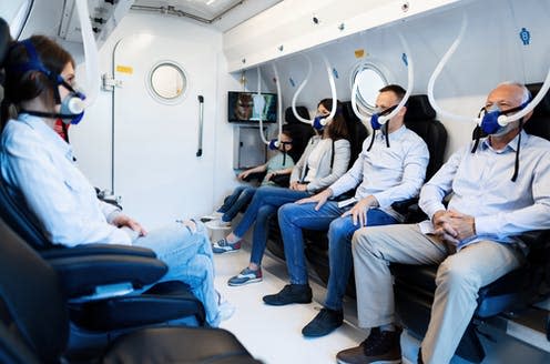 <span class="caption">People wearing masks while having oxygen therapy in hyperbaric chamber.</span> <span class="attribution"><a class="link " href="https://www.shutterstock.com/image-photo/group-mixed-age-people-wearing-masks-1400143358" rel="nofollow noopener" target="_blank" data-ylk="slk:Drazen Zigic/Shutterstock;elm:context_link;itc:0;sec:content-canvas">Drazen Zigic/Shutterstock</a></span>