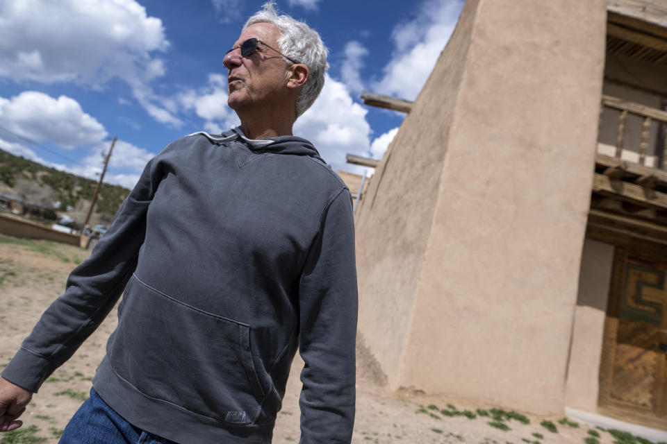 Frank Graziano, of the nonprofit Nuevo Mexico Profundo, which helps restore old churches in the region, stands outside the San Jose de Gracia Catholic Church, in Las Trampas, New Mexico, Friday, April 14, 2023. (AP Photo/Roberto E. Rosales)