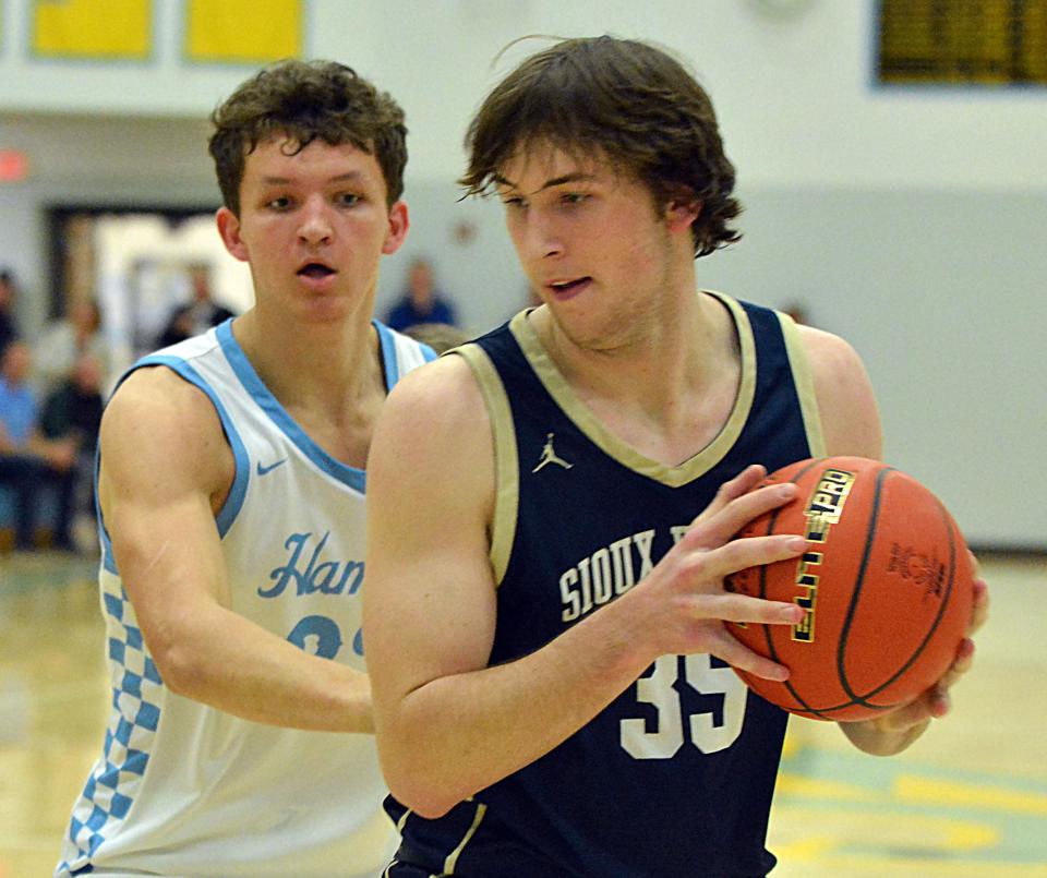 Sioux Valley's Alec Squires fields an entry pass against Hamlin's Zac VanMeeteren during their high school boys basketball game on Monday, Feb. 5, 2024 at the Hamlin Education Center. No. 2 Hamlin topped No. 4 Sioux Valley 80-48 in a battle of rated Class A teams.