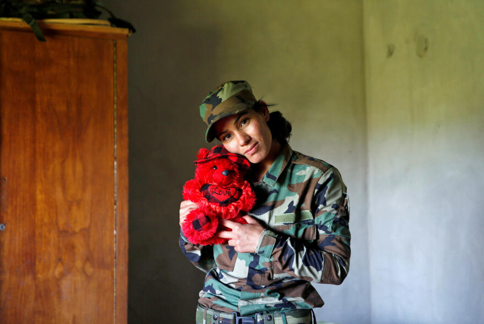 Dahir poses with a teddy bear. Many of the women had left their children and families to join this fight.