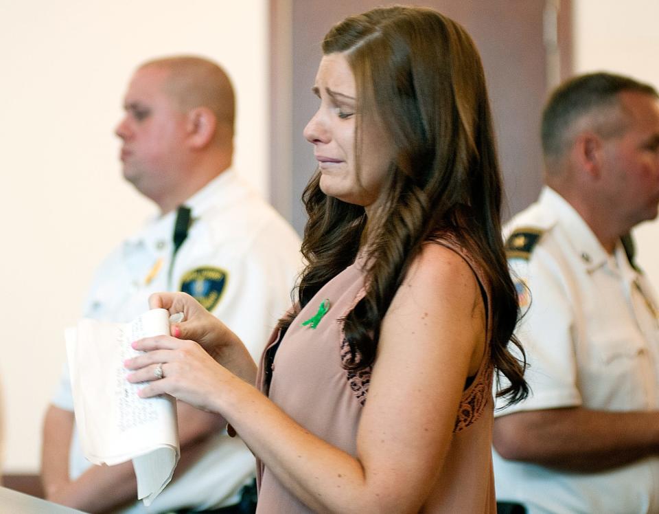 Jessica Simone reads a statement in 2014, during the trial of Matteo Trotto, who was convicted of murdering her father, Kevin Harkins. Mfouad A. Faris now faces a vehicular homicide charge in the crash that killed Simone in 2021.