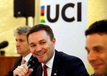 (L-R) Gabriele Fiono, Deputy Director of CEA Tech, Commissariat a l'energie atomique et aux energies alternatives (CEA), David Lappartient, President of the International Cycling Union (UCI), and Jean-Christophe Peraud, UCI Manager of Equipment and the Fight against technological fraud, attend a news conference on the fight against technological fraud in Geneva, Switzerland March 21, 2018. REUTERS/Denis Balibouse