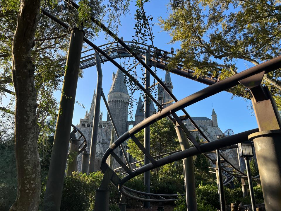 Hogwarts Castle is seen through Flight of the Hippogriff tracks at the Wizarding World of Harry Potter - Hogsmeade at Universal Islands of Adventure.