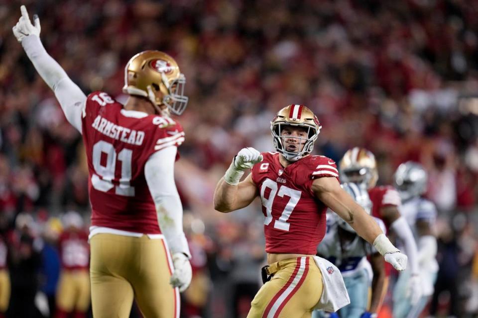 San Francisco 49ers defensive end Arik Armstead (91) and defensive end Nick Bosa (97) react after tackling Dallas Cowboys quarterback Dak Prescott during the second half of an NFL divisional playoff football game in Santa Clara, Calif., Sunday, Jan. 22, 2023. (AP Photo/Godofredo A. Vásquez) Godofredo A. Vásquez/AP