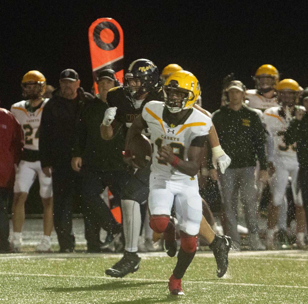 Catholic’s Emmanuel Ross runs for long yardage up the middle in second half action. Red Bank Catholic football defeats Toms River North 35-28 in Toms River, NJ on October 20, 2023.