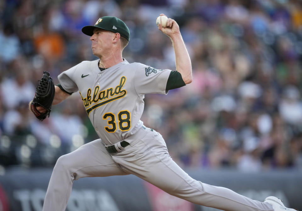 Oakland Athletics starting pitcher JP Sears works against the Colorado Rockies during the first inning of a baseball game Friday, July 28, 2023, in Denver. (AP Photo/David Zalubowski)