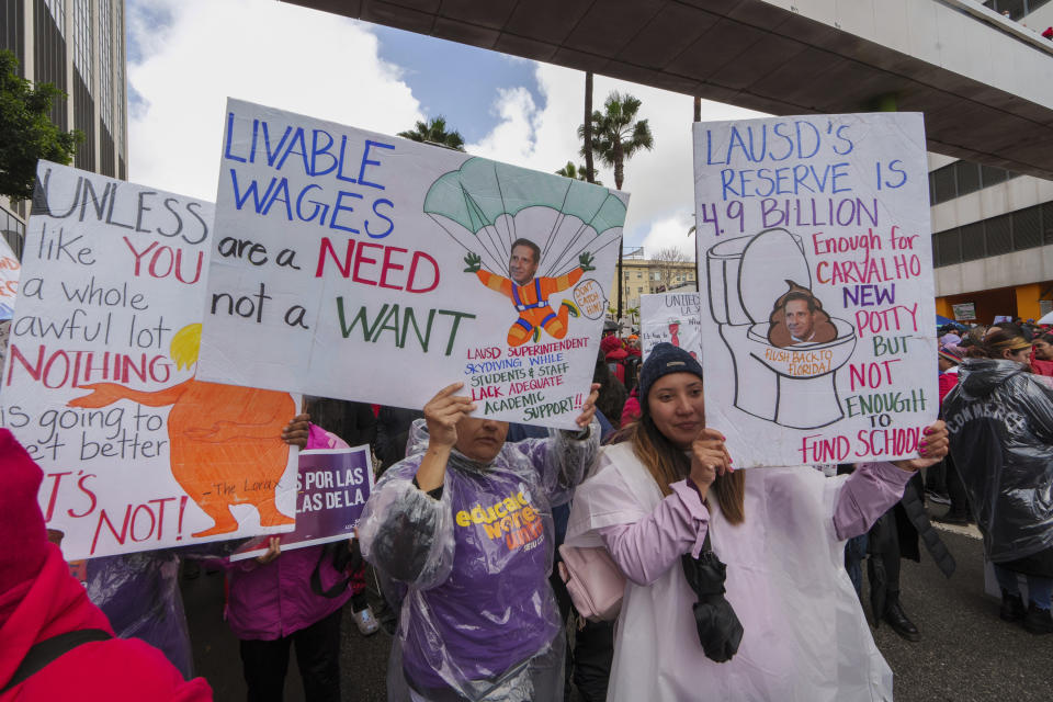 FILE - Los Angeles Unified School District teachers and Service Employees International Union 99 (SEIU) members rally outside the LAUSD headquarters in Los Angeles, Tuesday, March 21, 2023. According to an annual report published Thursday, Feb. 15, 2024, from the Labor Action Tracker, a collaboration between researchers at Cornell University and the University of Illinois, those involved in work stoppages climbed 141% in 2023 — from 224,000 to 539,000 striking workers. (AP Photo/Damian Dovarganes)