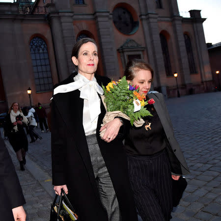 The Swedish Academy's Permanent Secretary Sara Danius and academy member Sara Stridsberg leave the Swedish Academy after a meeting, in Stockholm, Sweden April 12, 2018. Danius said to journalists that she would leave her position and the Swedish Academy immediately. TT News Agency/Jonas Ekstromer/ via REUTERS