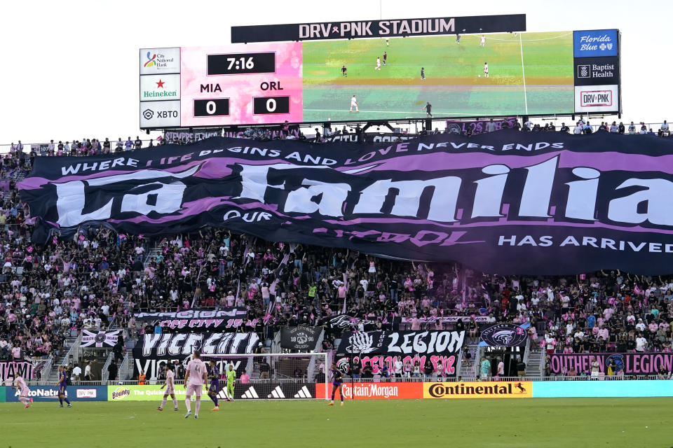 Inter Miami fans hold up La Familia banner during the first half of an MLS soccer match against Orlando City, Saturday, May 20, 2023, in Fort Lauderdale, Fla. (AP Photo/Lynne Sladky)