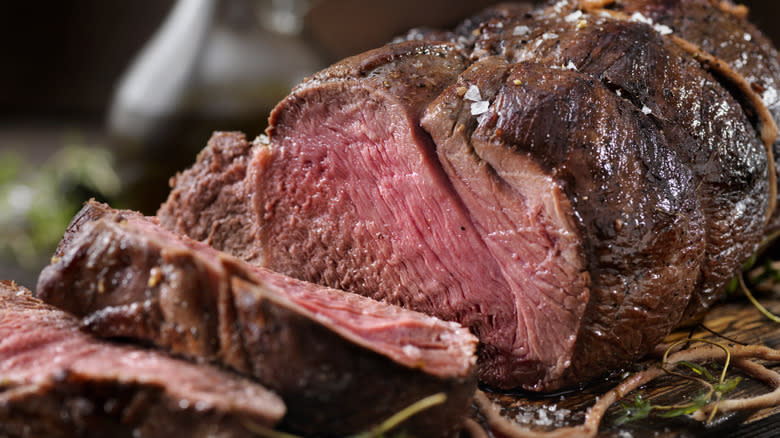 A prime rib roast sliced and ready to serve