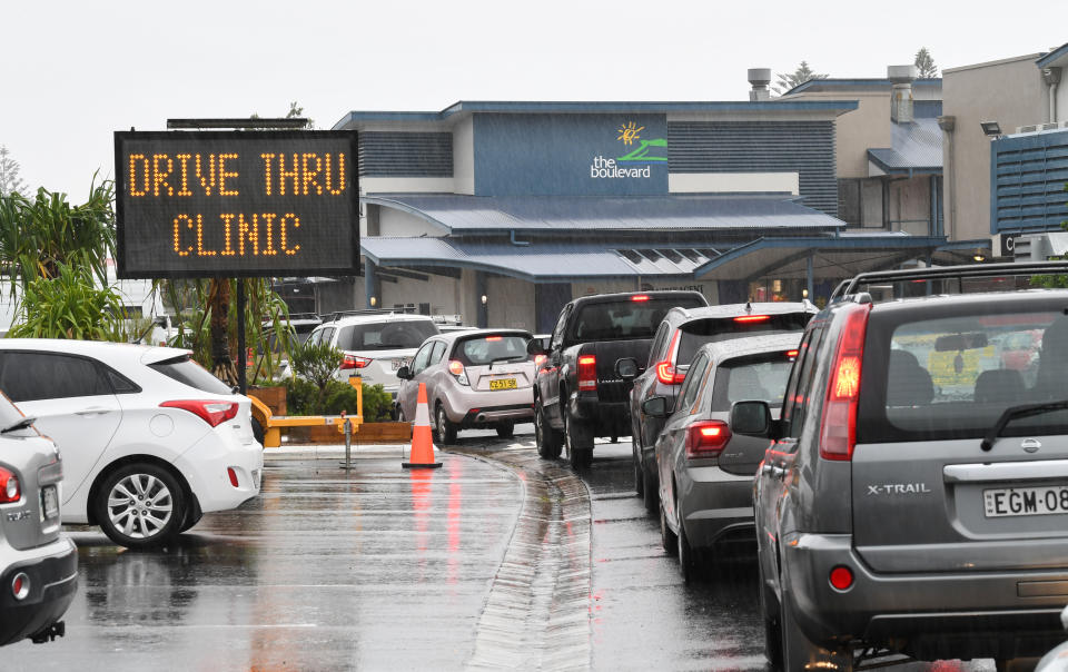 LENNOX HEAD, AUSTRALIA - APRIL 01: Cars queue outside a COVID-19 drive through at the Lennox Community Centre on April 01, 2021 in Lennox Head, Australia. The NSW Government has reintroduced restrictions for residents of Byron, Ballina, Tweed and Lismore shires after a new COVID-19 case was recorded in the area, linked to the current Brisbane coronavirus outbreak. Household gatherings are limited to 30 people, venue caps have returned to the four-square-meter rule and masks are now mandatory in retail and public transport settings. The restrictions will remain in place until 11:59 pm on Monday 5 April. (Photo by James D. Morgan/Getty Images)