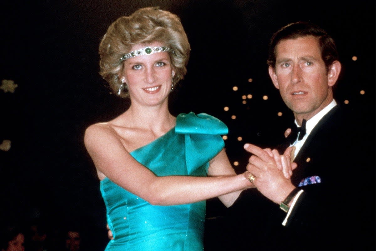 Princess Diana, with Prince Charles, wore a diamond choker necklace as a headband in Australia, in 1985 (Alamy)