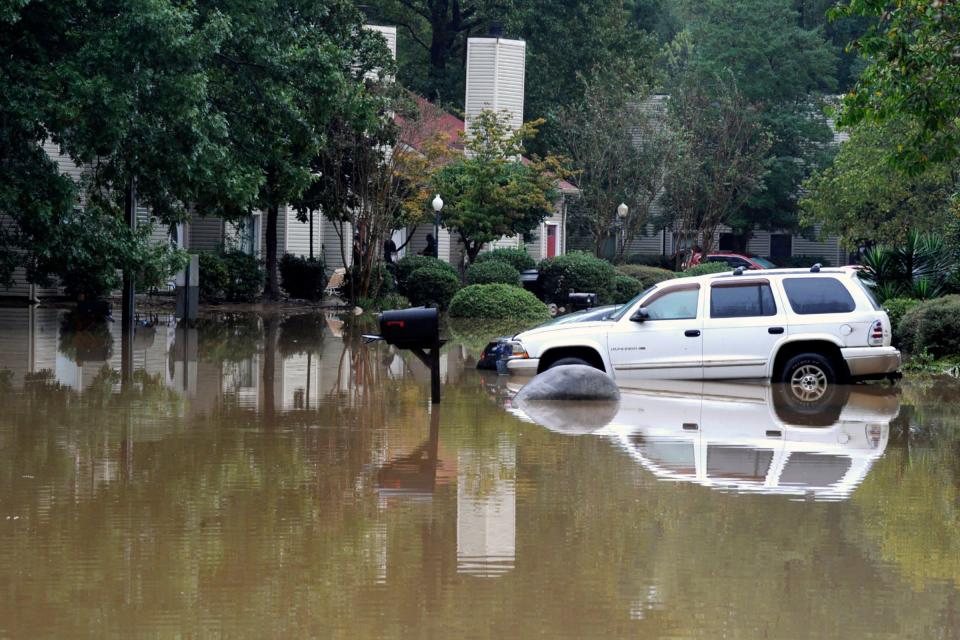 A flooded neighborhood is shown in Pelham, Ala., Thursday, Oct. 7, 2021. Parts of Alabama remain under a flash flood watch after a day of high water across the state, with as much as 6 inches of rain covering roads and trapping people.