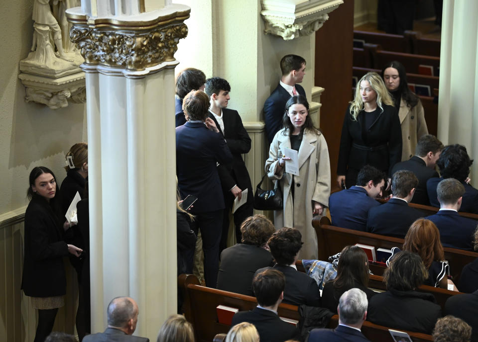 There is standing room only during family hour as family members friends and supporters console each other during the funeral mass for Brian Fraser at St Paul on the Lake Catholic Church, in Grosse Pointe Farms, Mich., Saturday, Feb. 18, 2023. Fraser was identified as one of three students slain during a mass shooting on Michigan State University's campus, Monday evening. (Todd McInturf/Detroit News via AP, Pool)