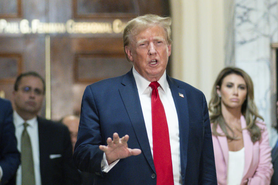 FILE - Former President Donald Trump speaks after exiting the courtroom for a break at New York Supreme Court, Dec. 7, 2023, in New York. The notorious 2005 “Access Hollywood” video in which Trump was caught on a hot mic speaking disparagingly about women over a decade before he became president can be shown to jurors deciding what he owes E. Jean Carroll, a columnist he defamed, a federal judge ruled Tuesday, Jan. 9, 2024, as he set up ground rules for a trial next week. (AP Photo/Eduardo Munoz Alvarez, File)