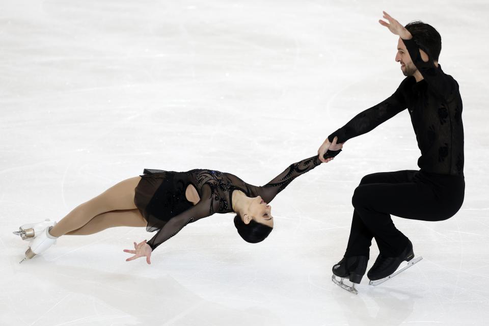 Deanna Stellato-Dudek and Maxime Deschamps perform in the pairs short program during the Grand Prix Skate America Series, Friday, Oct. 21, 2022, in Norwood, Mass. (AP Photo/Michael Dwyer)