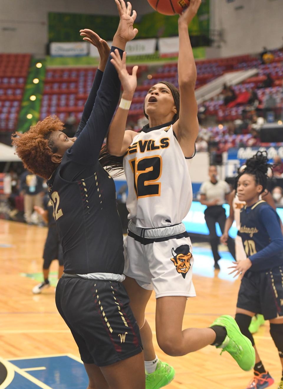 Winter Haven's Kayla Smith (12) shoots against Wekiva on Thursday during their Class 6A state semifinal at the RP Funding Center.