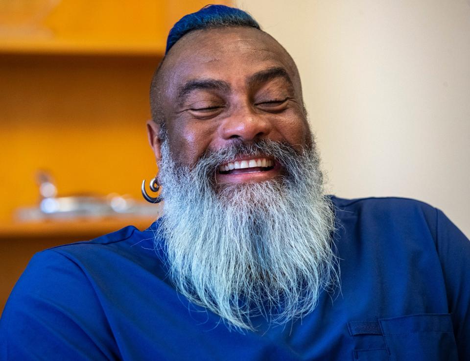 Registered Nurse André Chambers laughs while telling a story about his life during a break in his workday at the Betty Ford Center in Rancho Mirage, Calif., Thursday, July 6, 2023.