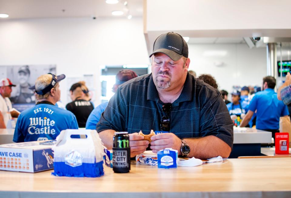 Chris Lewis, who grew up eating White Castle with his father, enjoys a slider for the first time since his father's death.