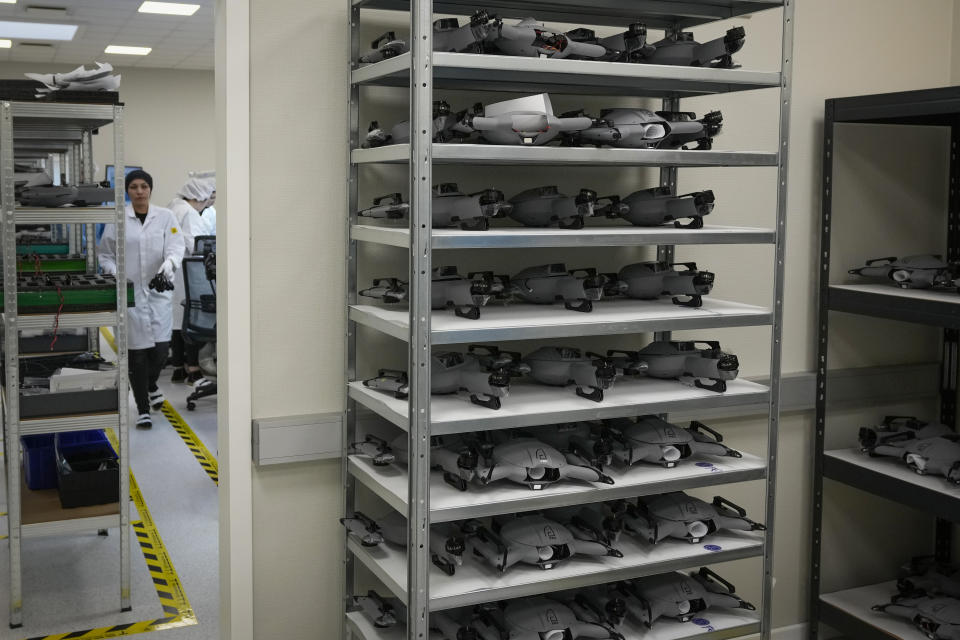 Ukrainian women assemble military drones at the drone manufacturer Atlas Aerospace in the capital Riga, Latvia, Wednesday, Feb. 1, 2023. Since Russia invaded Ukraine last February, Lithuania, Latvia and Estonia — three states on NATO’s eastern flank scarred by decades of Soviet-era occupation — have been among the top donors to Kyiv. (AP Photo/Sergei Grits)