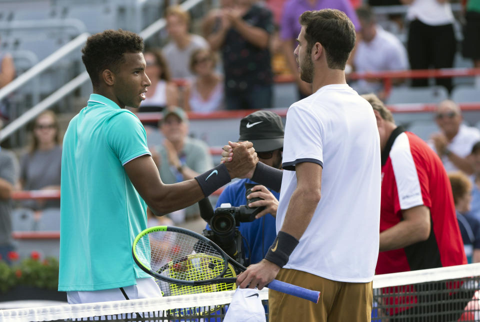 Felix Auger-Aliassime of Canada, left, congratulates Karen Khachanov of Russia on his victory during the Rogers Cup men’s tennis tournament Thursday, Aug. 8, 2019, in Montreal. (Paul Chiasson/The Canadian Press via AP)