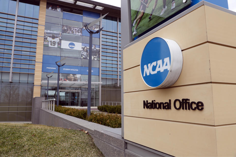 FILE - This March 12, 2020, file photo, shows the national office of the NCAA in Indianapolis. The NCAA will distribute $225 million to its Division I members in June, $375 million less than had been budgeted this year because the coronavirus outbreak forced the cancellation of the men's basketball tournament. (AP Photo/Michael Conroy, File)