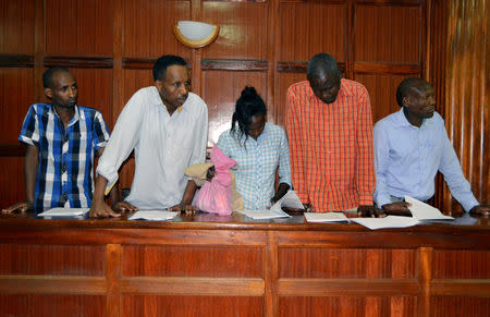 Suspects (L-R) Osman Ibrahim, Oliver Muthee, Gladys Kaari, Guled Abdihakim and Joel Nganga stand in the dock inside the Mililani Law Courts where they appeared in connection with the attack at the DusitD2 complex, in Nairobi, Kenya January 18, 2019. REUTERS/Stringer