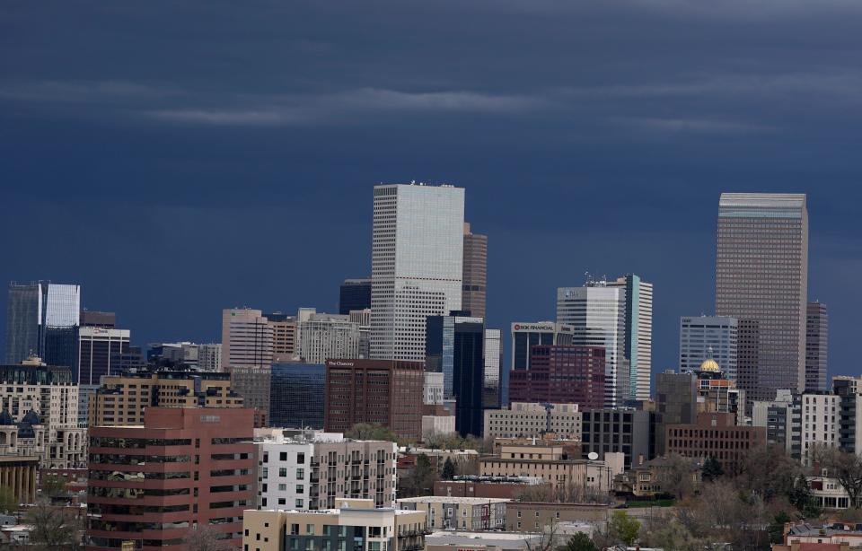 Storm clouds are pictured moving over the skyline in Denver. Forecasters predict that the stormy weather will be on tap from Sunday through Tuesday as a cold front packing heavy rains, cooler temperatures and possibly hail will settle over the intermountain West.