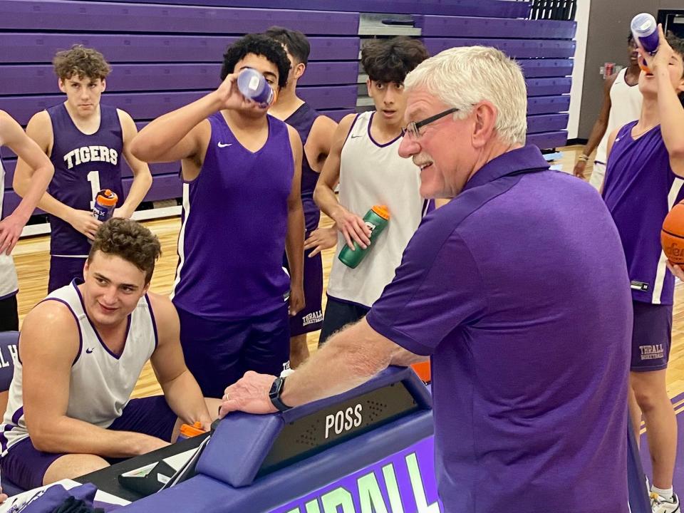 Thrall coach Charles Tindol chats with his players during a water break at practice Monday. The Tigers will play in this week's UIL state basketball tournament in San Antonio, hoping to become Thrall's first boys team state champions.