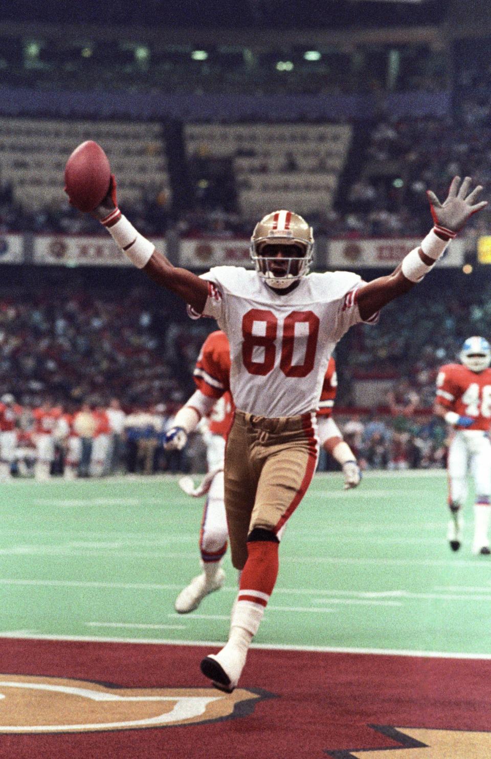 San Francisco 49ers receiver Jerry Rice (80) reacts after scoring a touchdown against the Denver Broncos during Super Bowl XXIV at the Superdome on Jan. 28, 1990, in New Orleans. A three-time Super Bowl champion and 10-time first-team All-Pro player who remains the career leader for most major statistical categories for receivers, Rice is an alum of HBCU Mississippi Valley State.